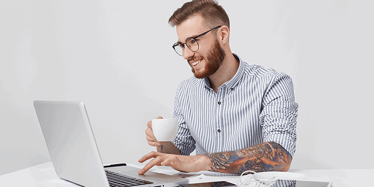 a professional man browsing using a laptop